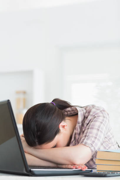 istock Woman leaning on the table next to a computer 847724544