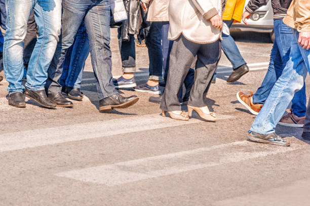istock people crossing the pedestrian crossing 847726020