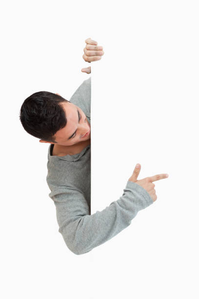istock Young male pointing around the corner 847744876