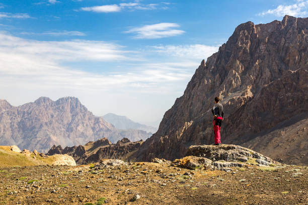 istock Hiker man stays on the mountain hill 847744900
