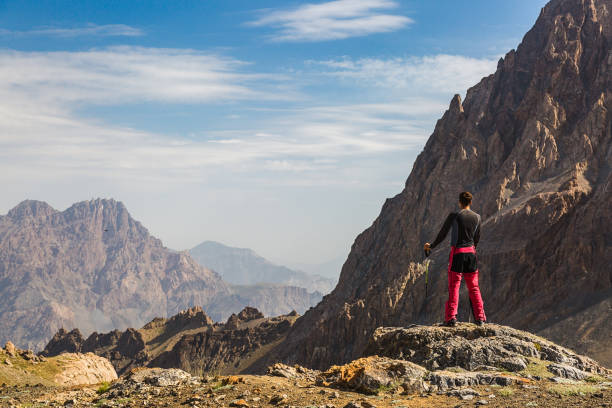 istock Hiker man stays on the mountain hill 847744992