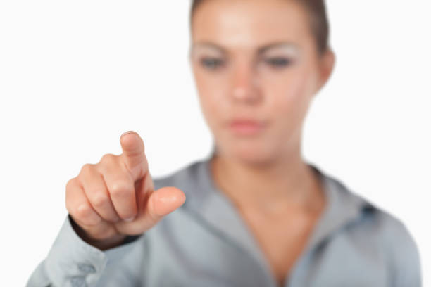 istock Serious businesswoman pressing an invisible key 847746432