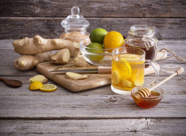 istock Ginger tea and ingredients on a  grunge wooden background 847751566