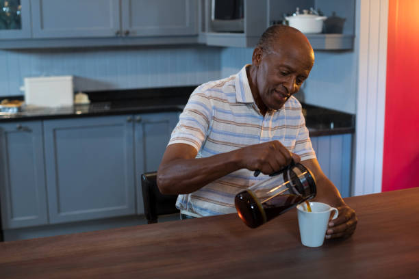 istock Senior man pouring coffee in cup 847756612
