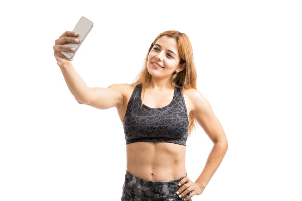 istock Woman with abs taking a selfie 847759050