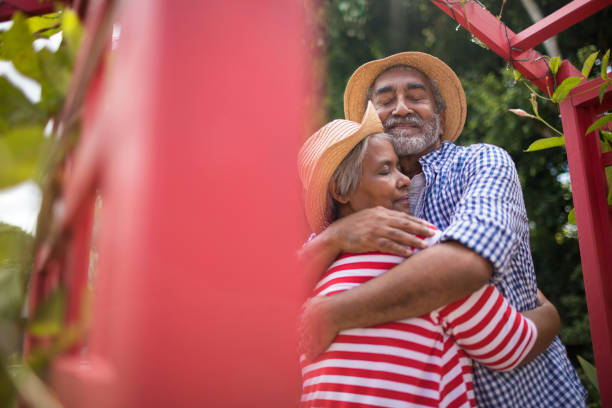 istock Low angle view of affectionate senior couple embracing 847759752