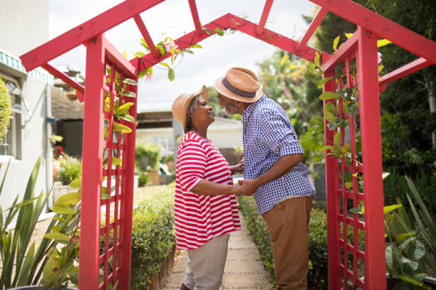 istock Side view of couple talking in yard 847759784