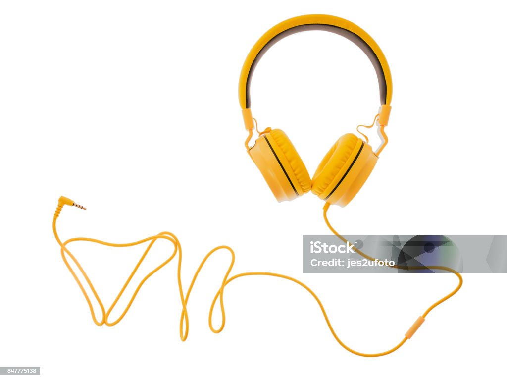 yellow headphones or earphone computer isolated on a white background yellow headphones or earphone computer isolated on a white background. Headphones Stock Photo