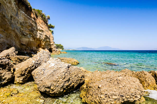 istock Sea erosion of rugged cliffs on rocky coastline 847781952