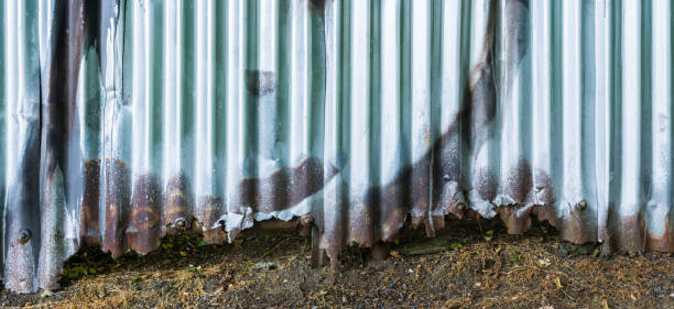 istock Corroded fence from corrugated iron 847786374