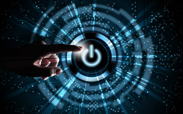 Pressing power button Hand pressing power button on blue digital background start button stock pictures, royalty-free photos & images