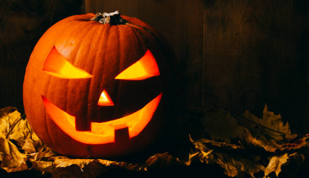 istock Halloween pumpkin on wooden background 847799506
