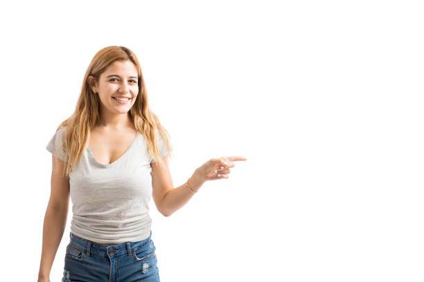 istock Woman pointing towards copy space 847801132