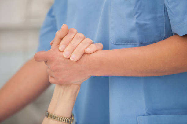 istock Nurse holding hands of the elderly lady 847807544