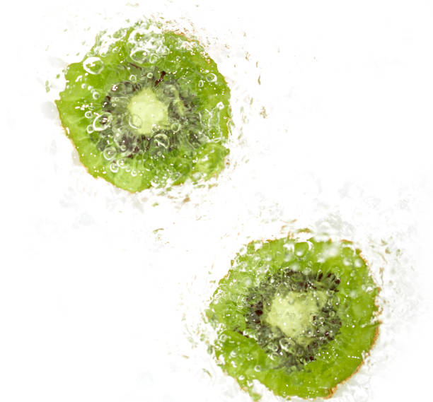 istock juicy kiwi fruit in water on a white background. macro 847814800