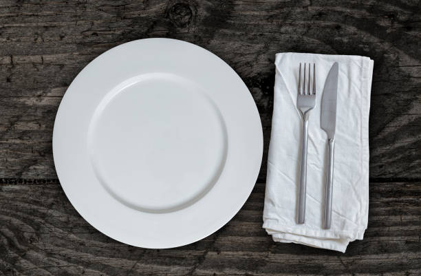 istock Empty plate with cutlery on brown vintage wood 847815134
