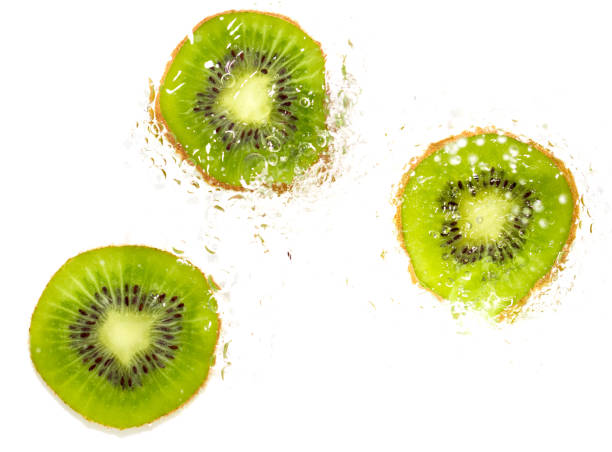 istock juicy kiwi fruit in water on a white background. macro 847818072