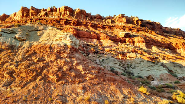 Photo of Extreme erosion below outcrops of Shinarump geological rock formation in Rockville Utah at sunset