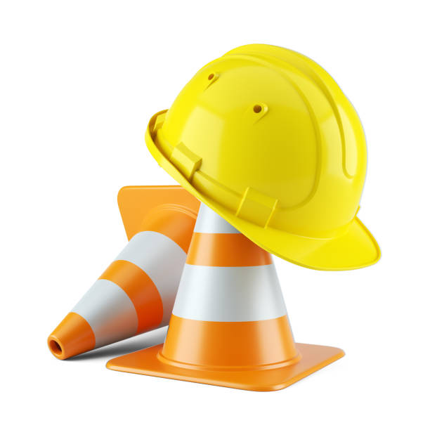 istock Construction helmet on traffic cones isolated on white background 847825366