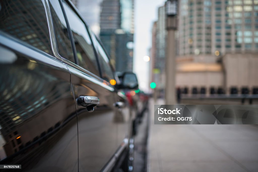 Passenger door handle of a black SUV Passenger door handle of a black SUV in the city Sports Utility Vehicle Stock Photo