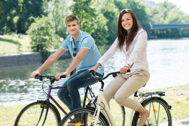 istock Smiling Couple On Bicycle In The Park 847833220