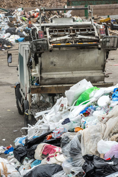 istock Dump Truck Delivering Garbage At The Collection Center 847834640