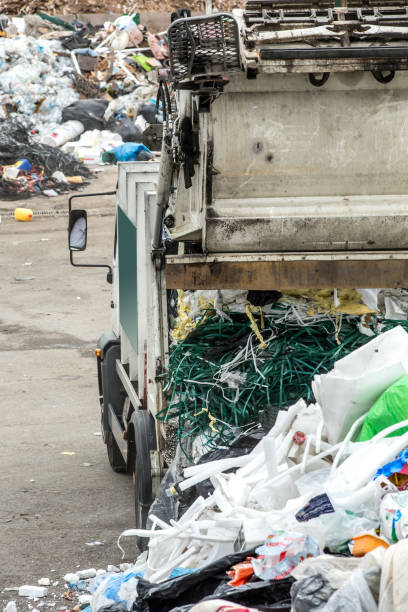 istock Dump Truck Delivering Garbage At The Collection Center 847834690