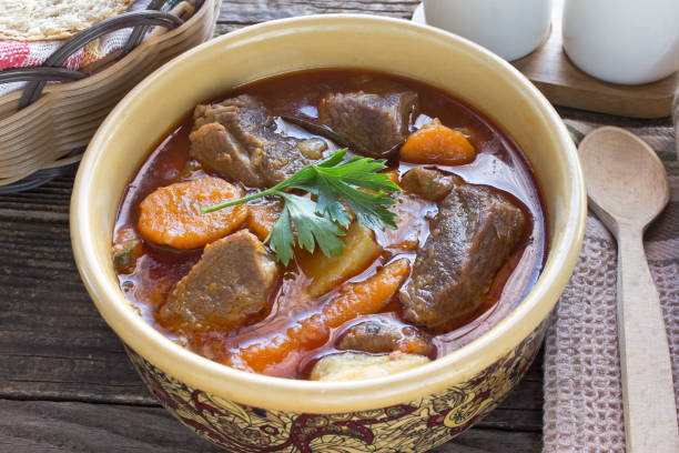 istock Stew with meat and vegetable in ceramic bowl on table 847839382