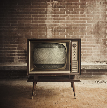 Vintage television inside an abandoned home.