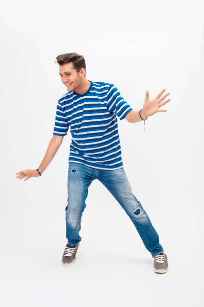 istock Portrait of happy young man dancing over white background 847850538