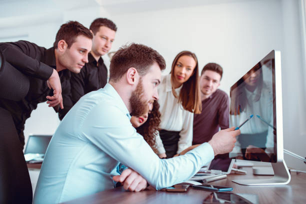 istock Group of Young Coworkers Working on Project in Modern Office 847850720