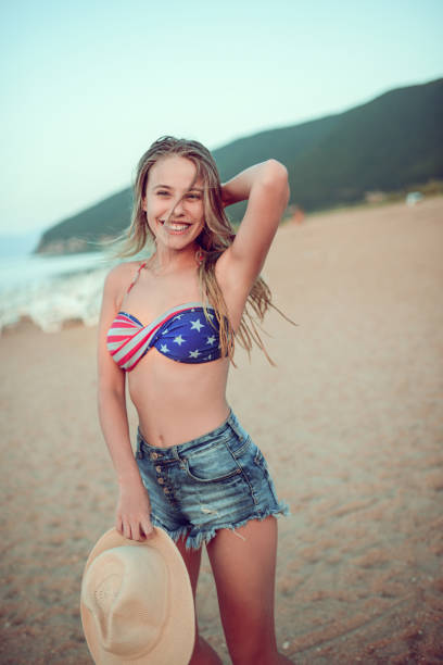 istock Excited Smiling Female Flirting and Dancing on Summer Beach Sand 847854280