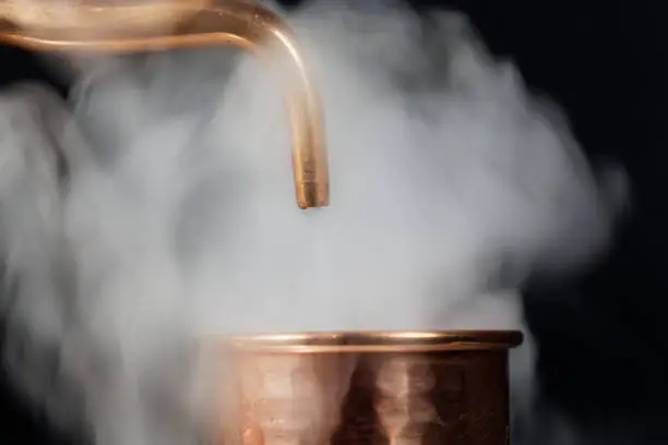 Photo of Copper pipe with steam