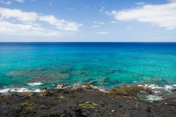 istock Crystal clear ocean waters with rocks in the foreground 847879596