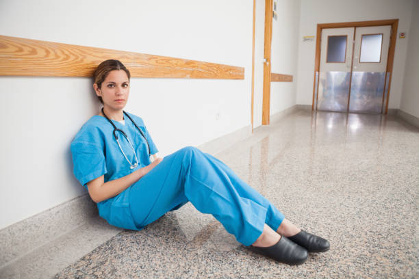 istock Nurse is sitting on the floor 847879880