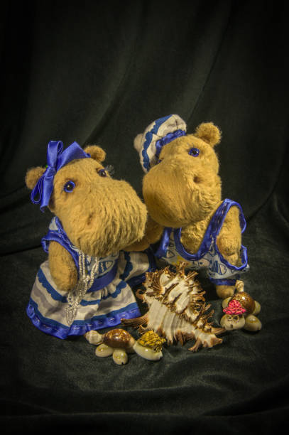 istock Two dolls of hippos, dressed in naval clothing. 847880014