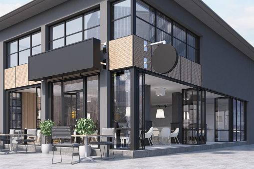 Modern black and gray cafe interior with a round and a rectangular signs, wooden tables and metal chairs. 3d rendering mock up