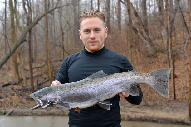 istock Proud angler with his trout 847889810