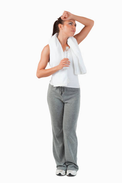 istock Young woman wiping off sweat from her forehead 847899384