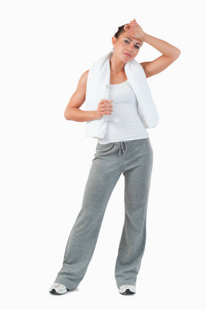 istock Young female wiping off sweat off her forehead 847899412