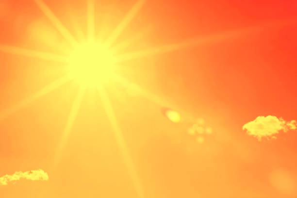 istock Hot summer sun in the sky (toned in orange) 847902052