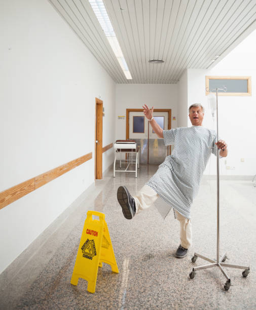 istock Patient pretending to slip on wet floor 847904968