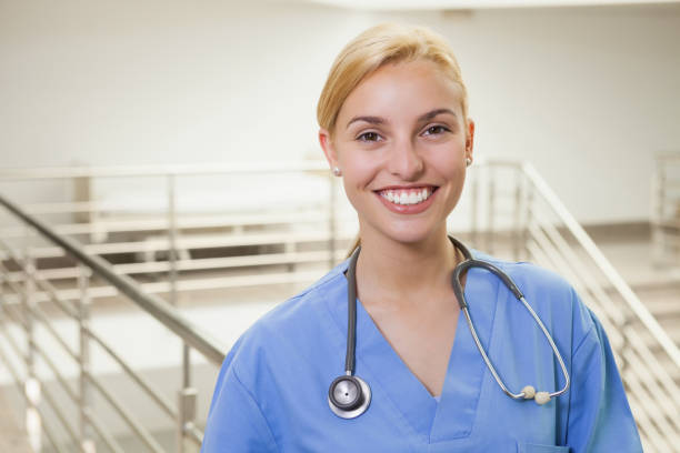 istock Nurse in a stairwell smiling 847905282