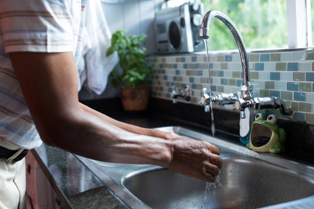 istock Midsection of man washing hands 847912818