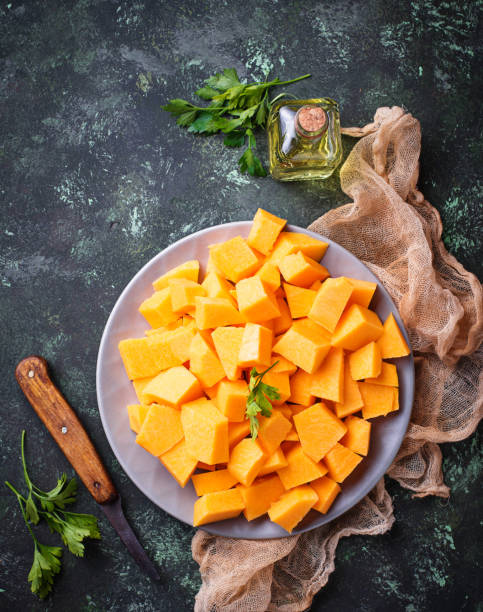 istock Raw chopped pumpkin on concrete background 847913968