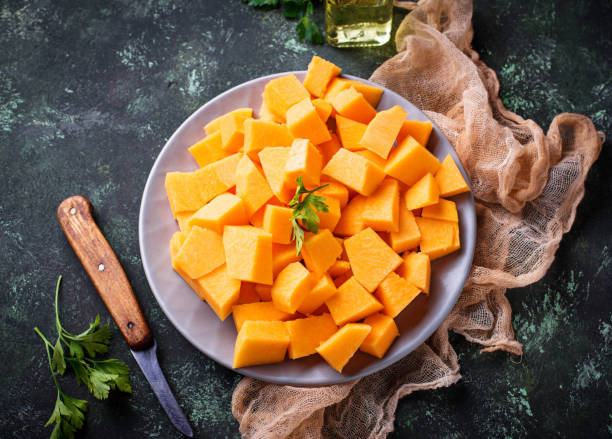 istock Raw chopped pumpkin on concrete background 847915646