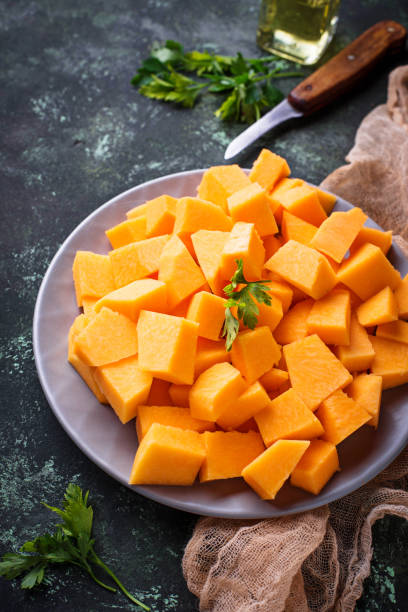 istock Raw chopped pumpkin on concrete background 847915722