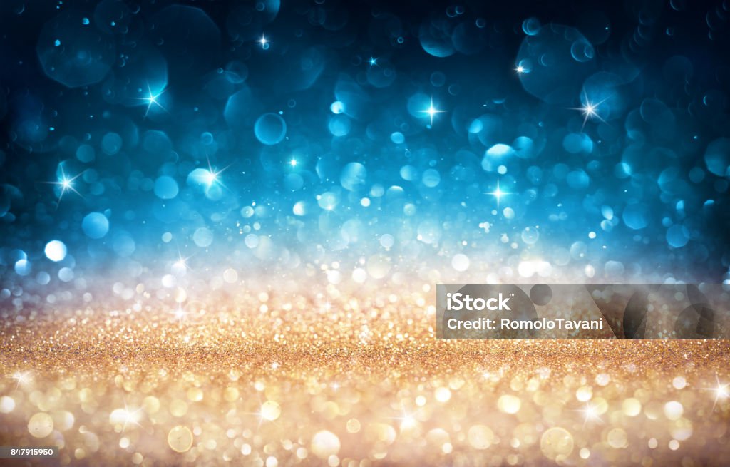 Xmas Shiny Background - Golden And Blue Bokeh Glitter Lights Golden And Blue In Christmas Backdrop Blue Stock Photo