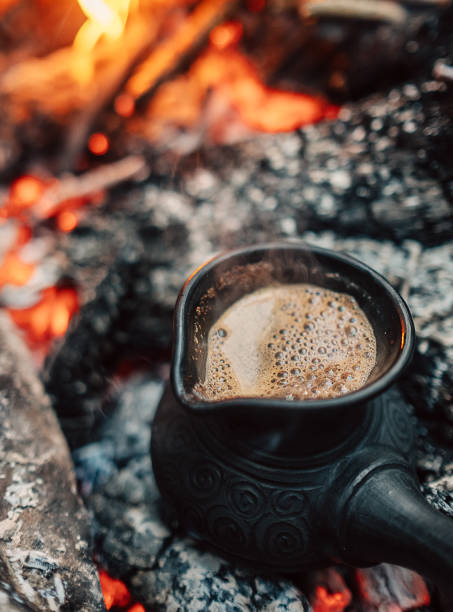 istock Boil coffee on turkish cezva on campfire coals 847921152