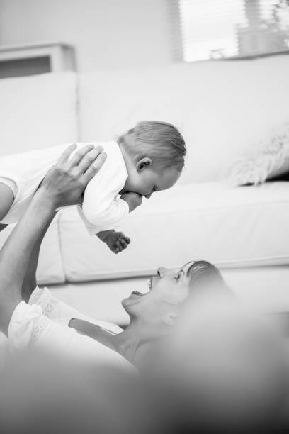 istock Mother lifting her baby 847925942
